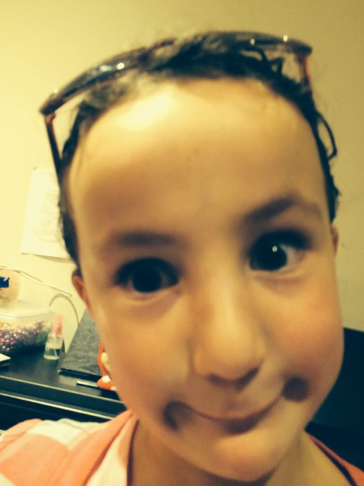 Close-up portrait of a girl pulling a face