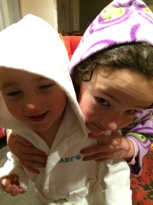 Two children in hooded towels