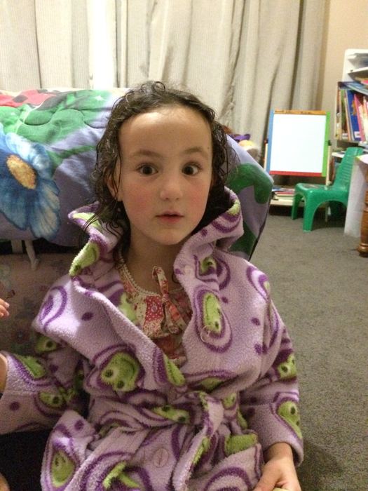 Girl in a dressing gown in the living room