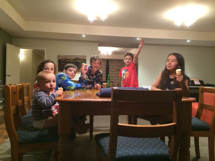 Family gathered around a dining table