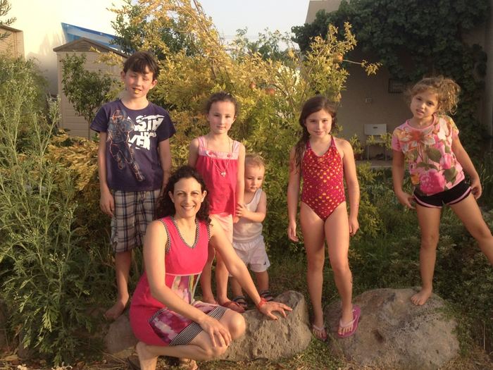 Family group outdoors in the evening