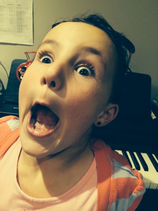 Girl making a surprised face at the camera