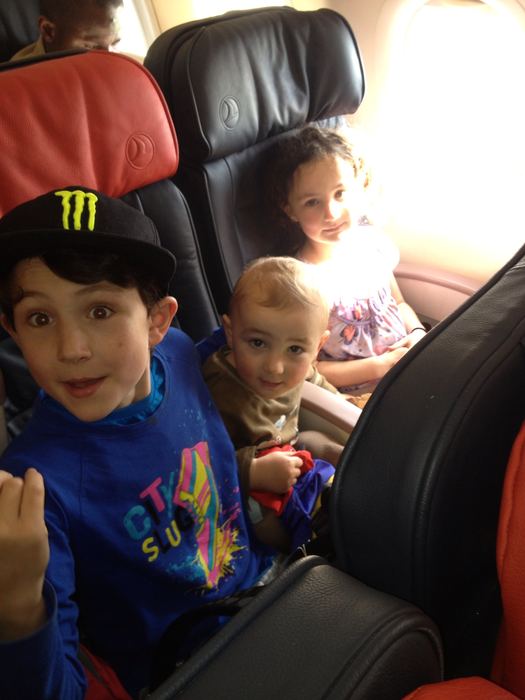 Two children in the back seat of a car