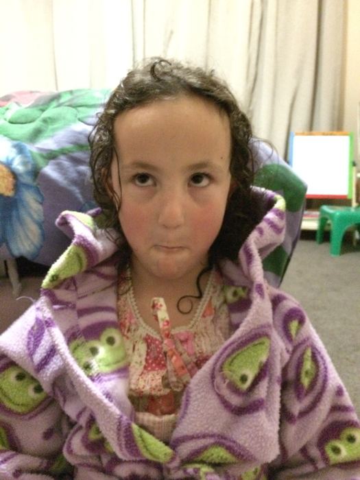 Girl in a dressing gown looking at the camera