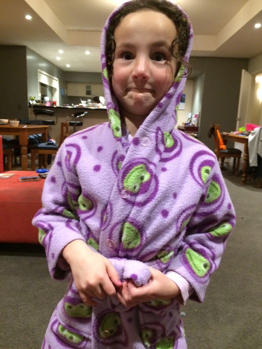 Girl with her dressing gown hood pulled up