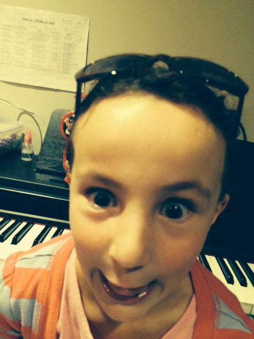 Close-up selfie of a girl at the piano
