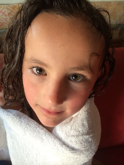 Close-up portrait of a girl with wet hair