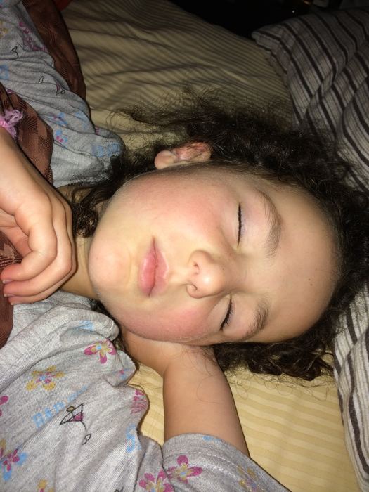 Child asleep on a pillow