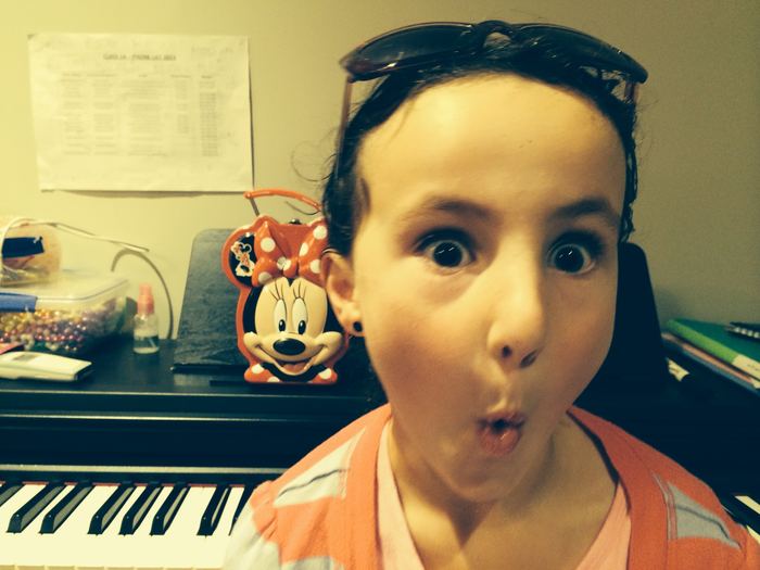 Wide-eyed selfie at the piano