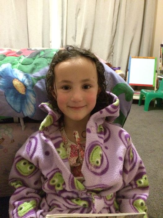 Girl in a patterned dressing gown at home